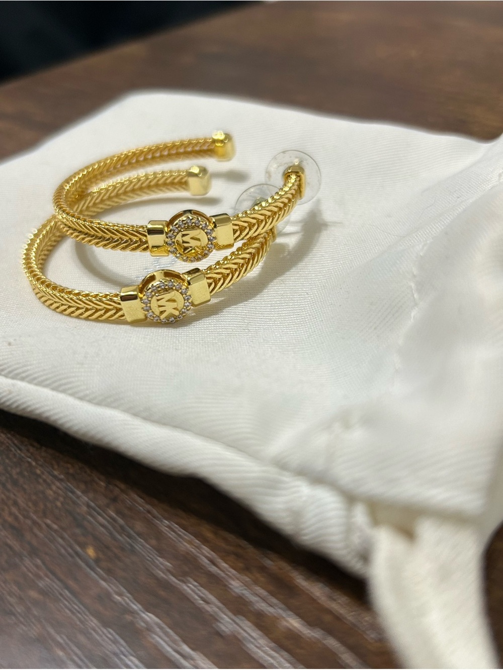 Michael Kors Gold-Tone Twisted Hoop Earrings with MK Logo